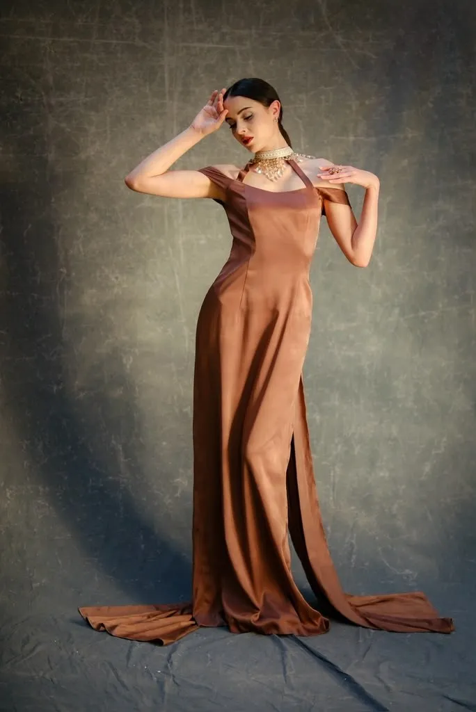 Bronze silk gown with a high slit