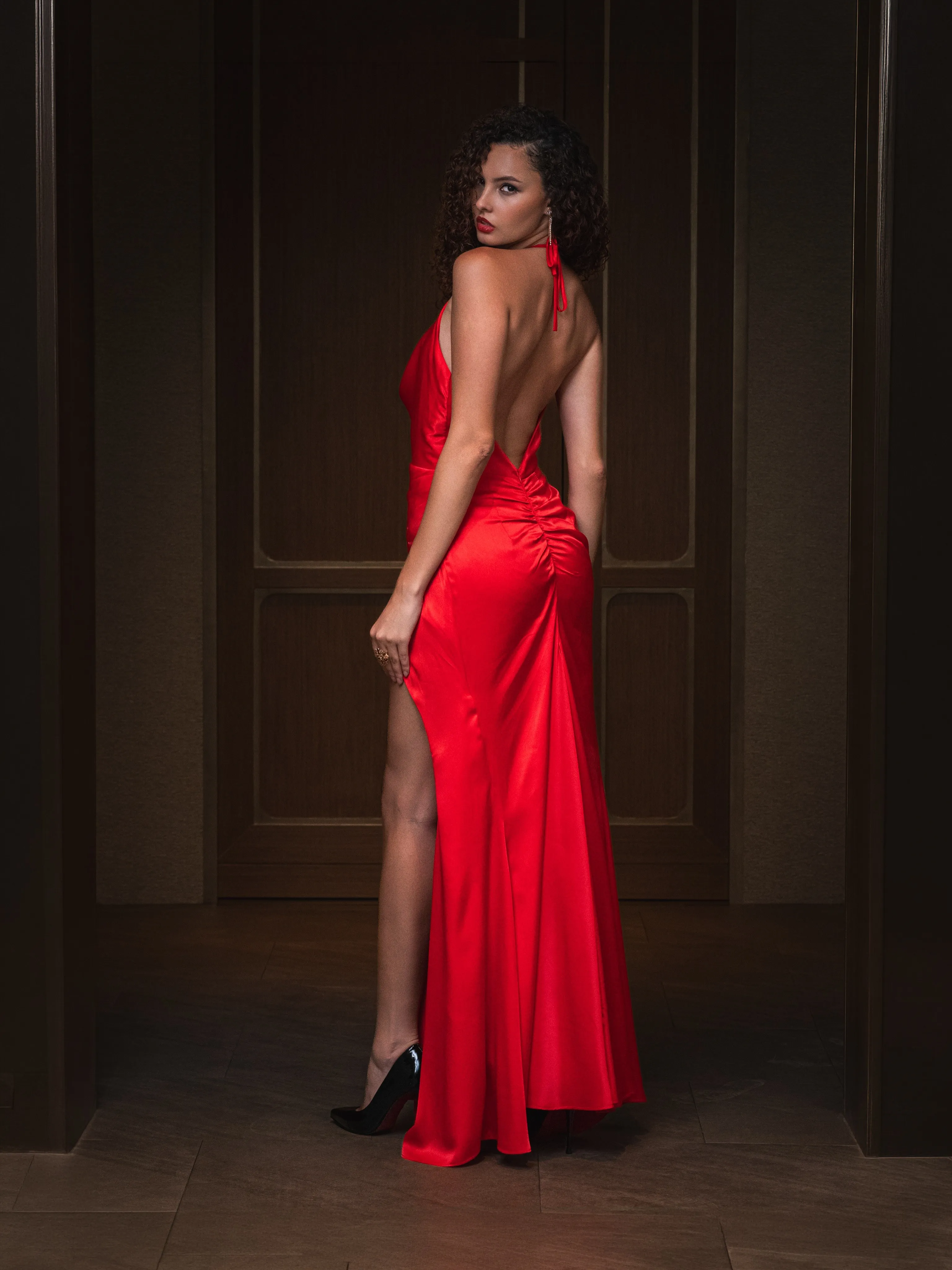 Red silk gown with a high slit