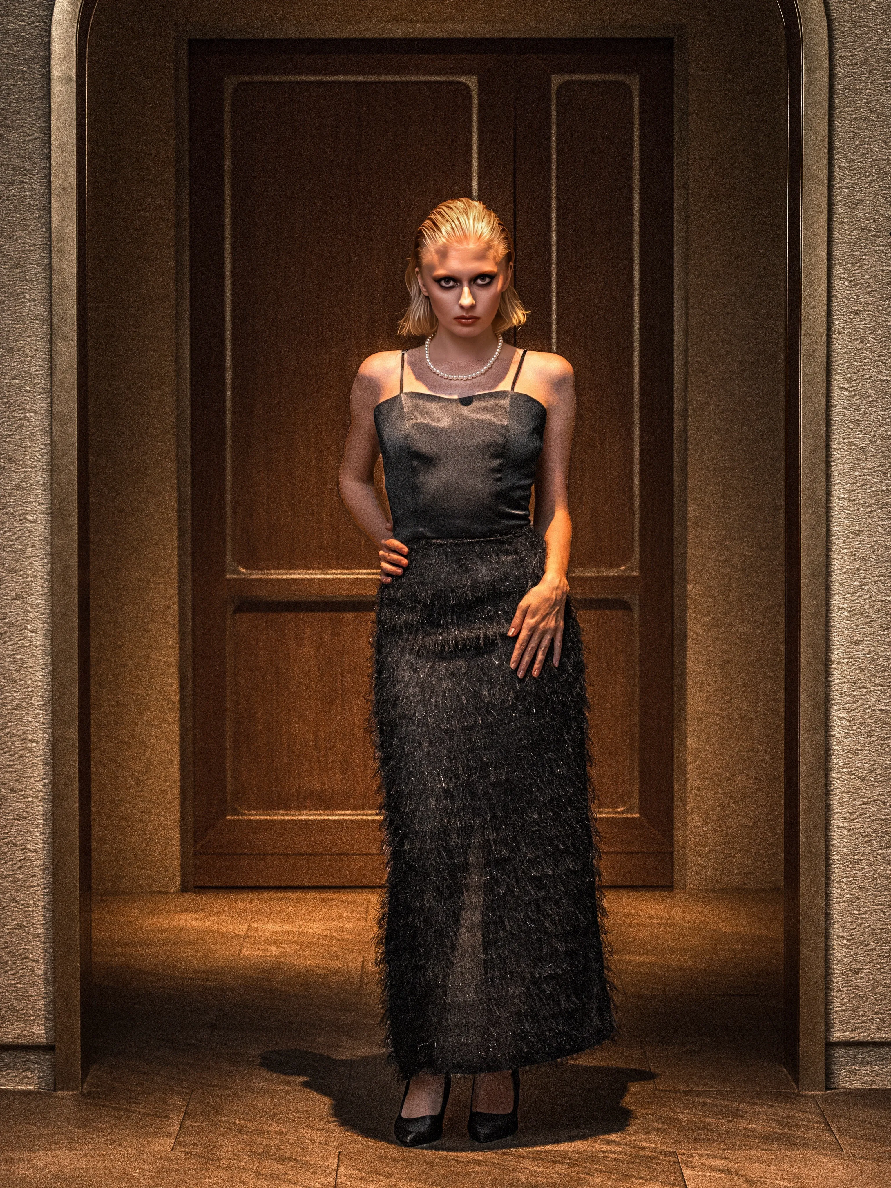 Black beaded gown at the door