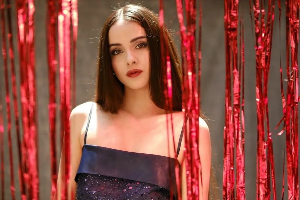 Portrait against red cord