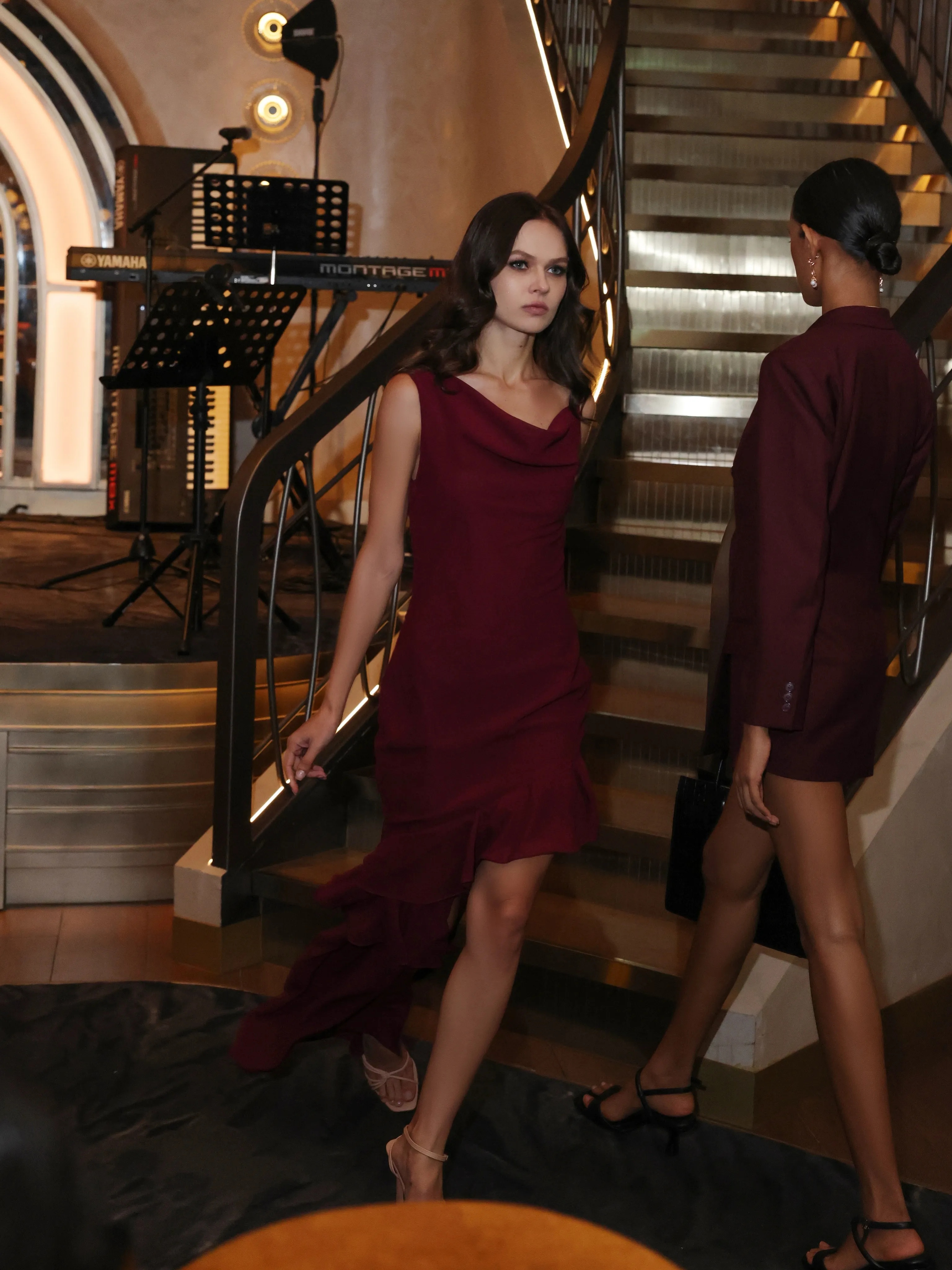 Burgundy slip dresses on the staircase