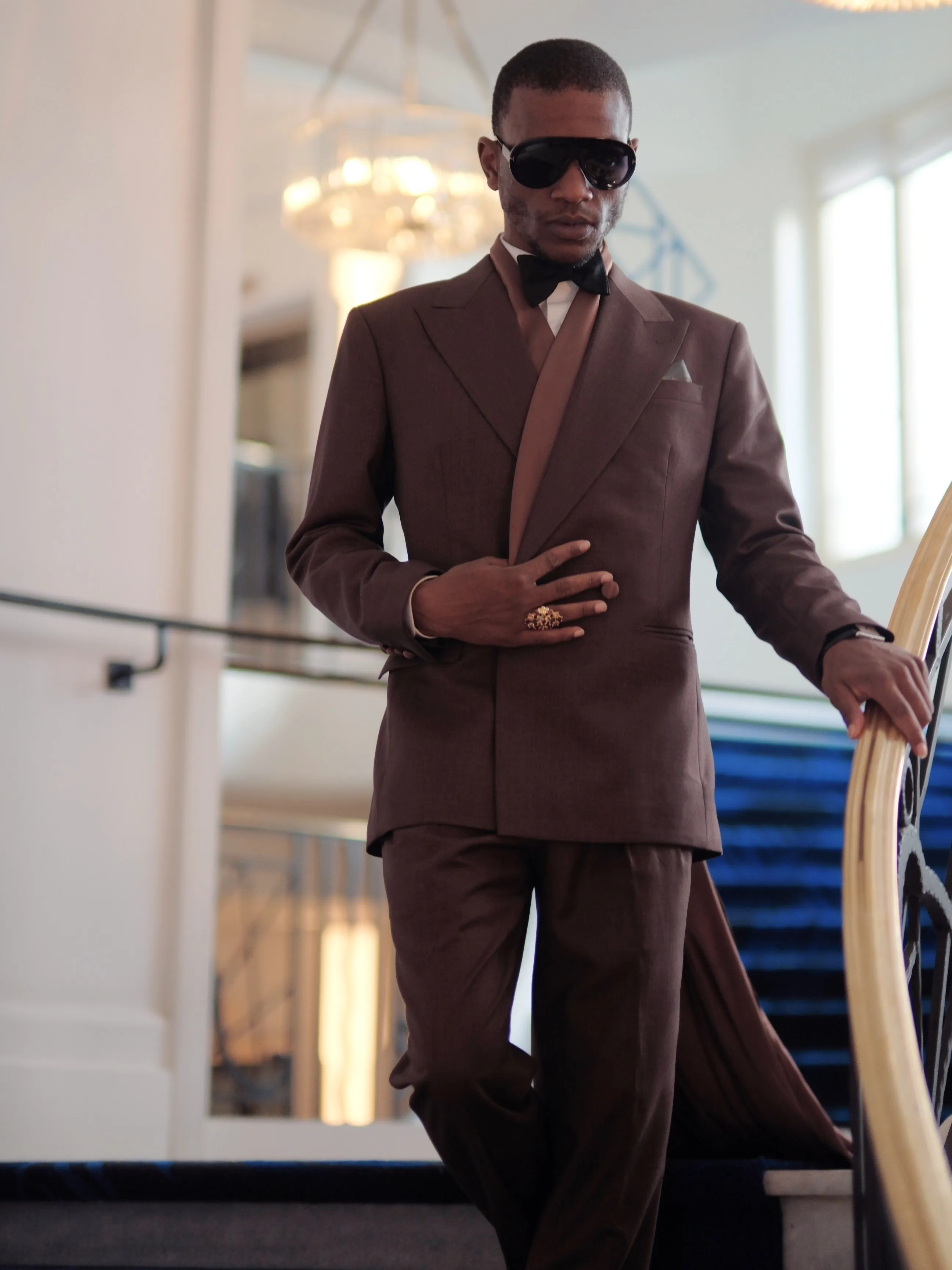 Brown suit with bow tie