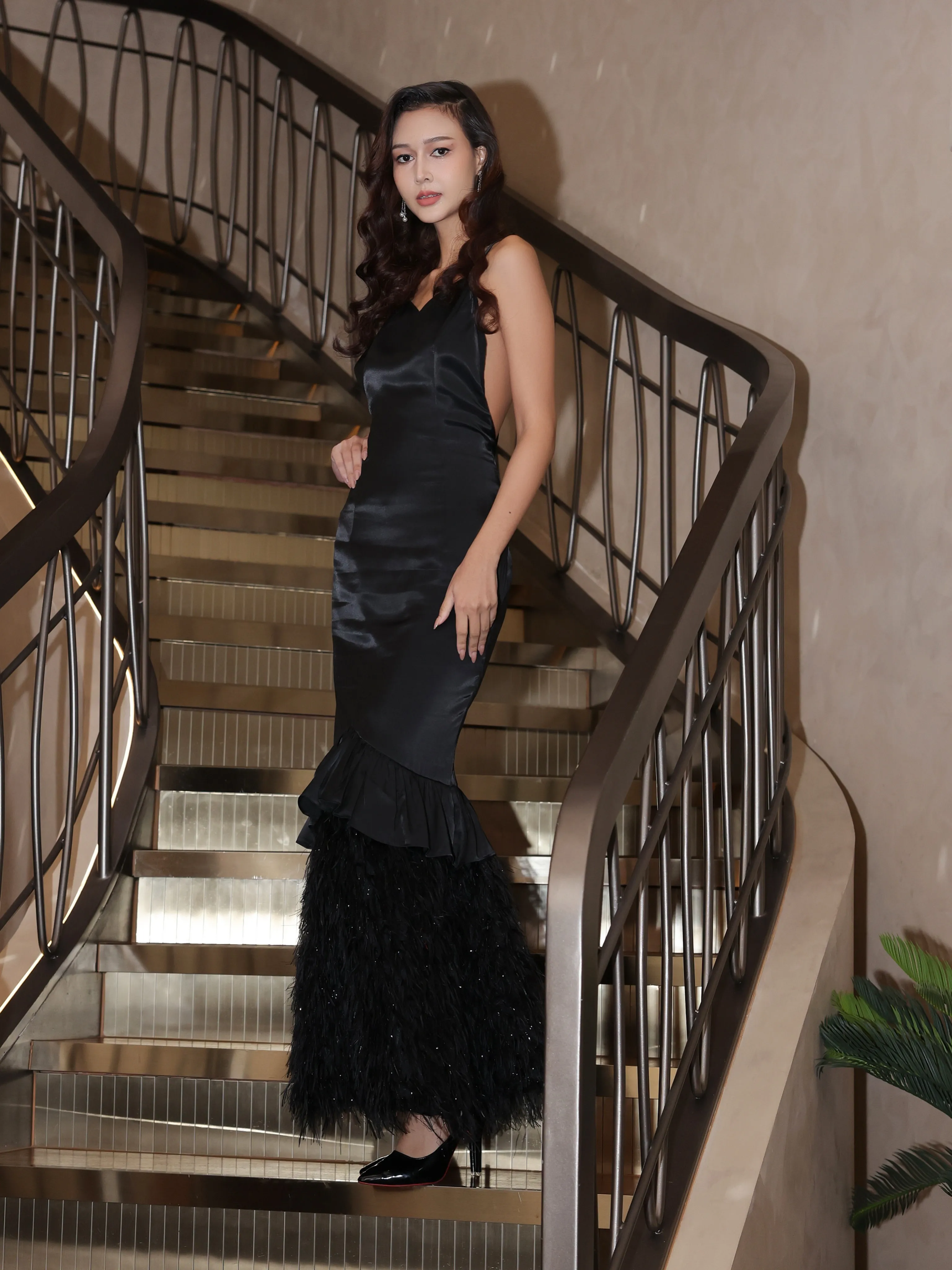 Black slip gown on the stairs