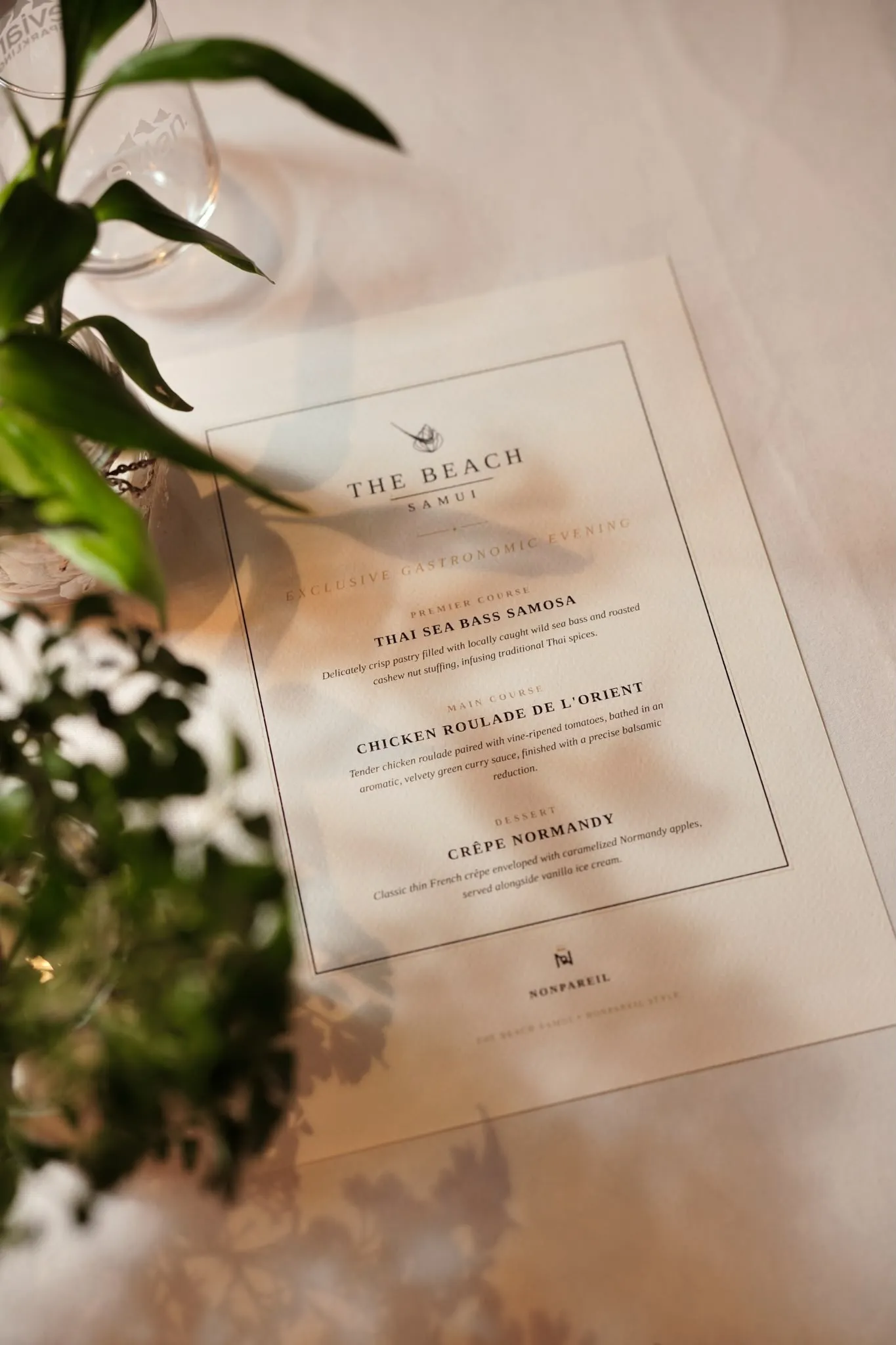 The menu card in the light, with white flowers