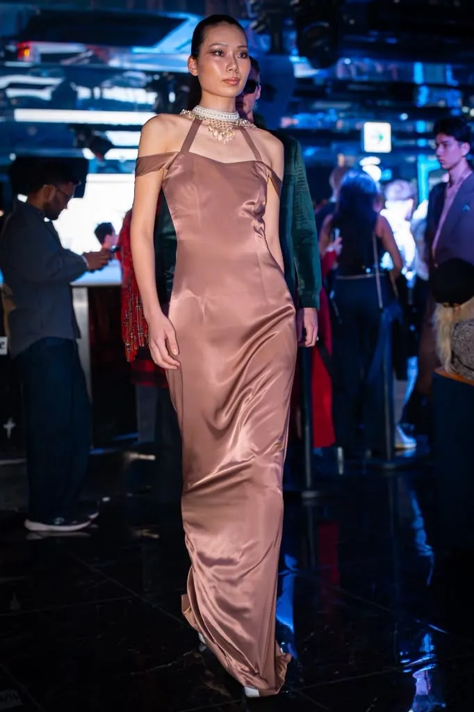 Bronze silk gown on the runway