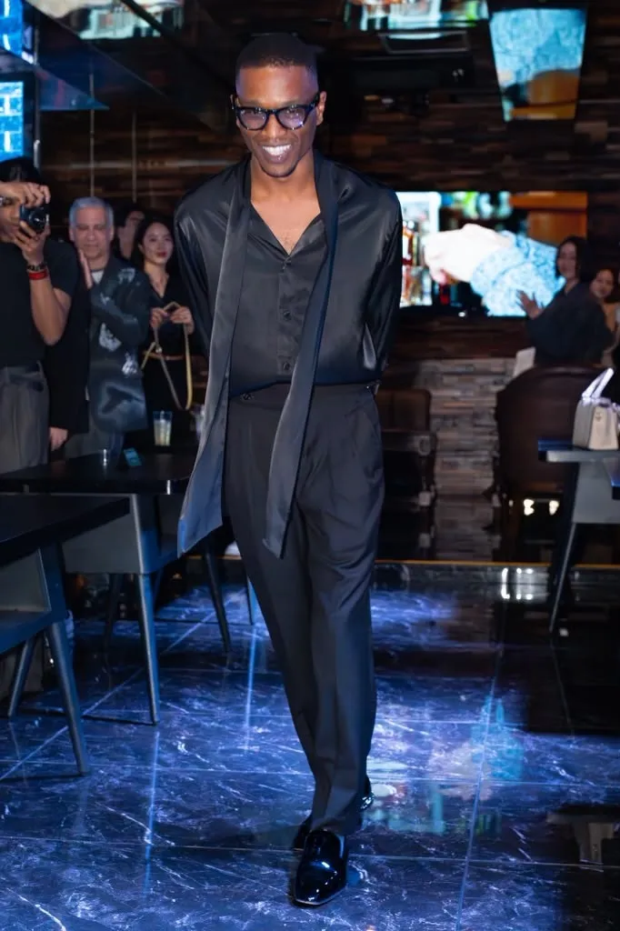 Travon Ridley-Evans on the runway in sheer grey
